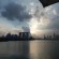 Taken on 18 August 2014 on Marina Barrage. The setting sun is peaking through the clouds over Marina Bay Sands.